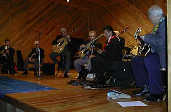 Jazz guitarists (left to right) Steve Blailock, Skeets McWilliams, Mundell Lowe, Lloyd Wells, Bucky Barrett, and Bob Saxton at recent Great Jazz Guitarists' Reunion benefit for Mississippi Music Hall of Fame, June 6, 1998, in Jackson, Mississippi. Photo by Nancy N. Jacobs