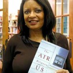 Deborah Johnson displays her newest novel. Photo by Nancy Jacobs